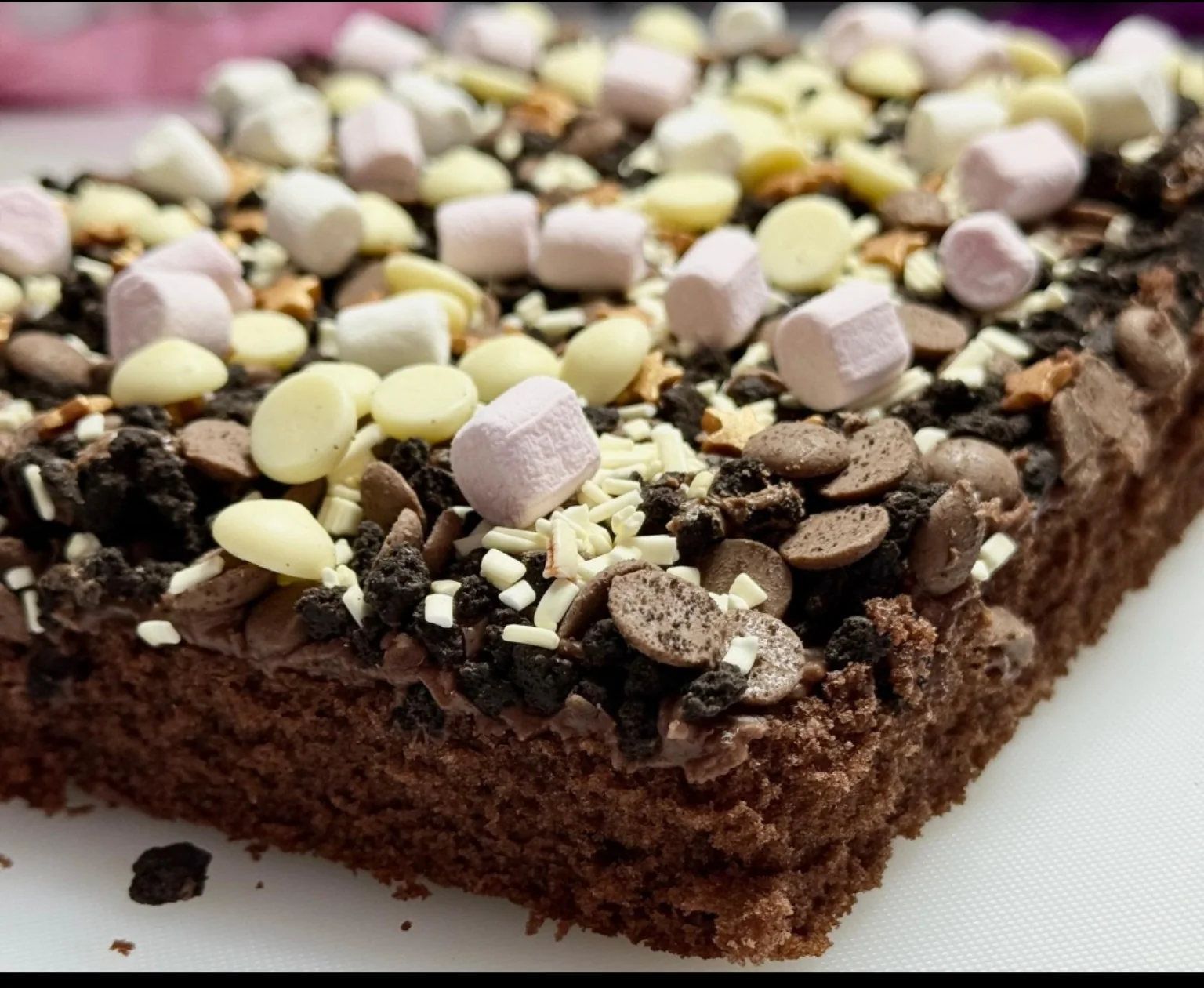 Chocolate tray bake topped with marshmallows and chocolate pieces